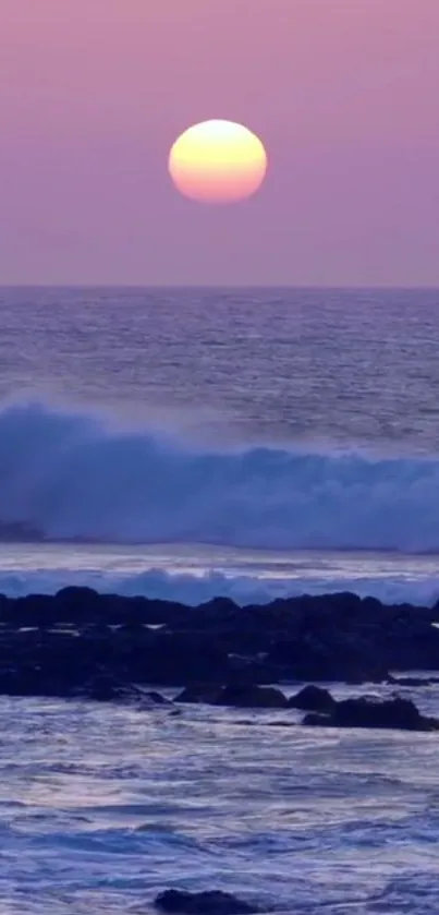 Serene ocean sunset with purple sky and waves crashing gently.