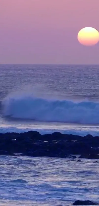 Purple and pink ocean sunset with waves and horizon.