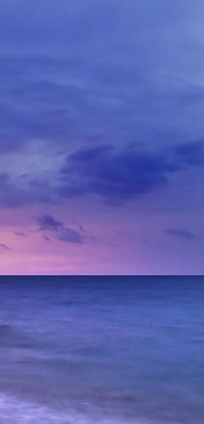 Purple ocean sunset with calm waters and serene sky