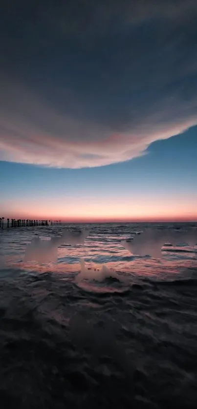 Serene ocean sunset with calm waves and vibrant skies, perfect mobile wallpaper.