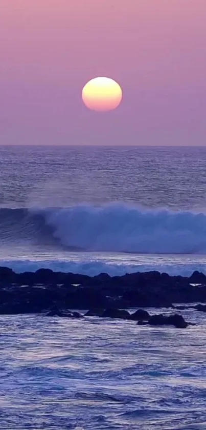 Purple ocean sunset with waves and serene coastal view.