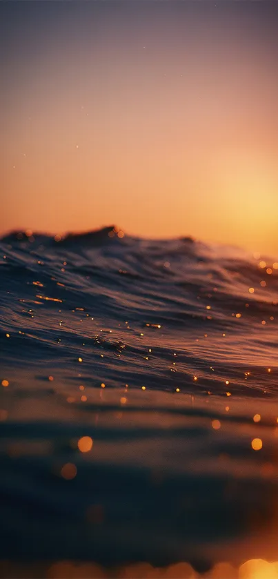Serene ocean waves at sunset with a warm glow.