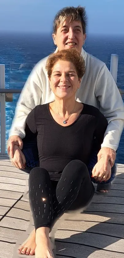 Couple enjoying serene ocean view on a sunny day.