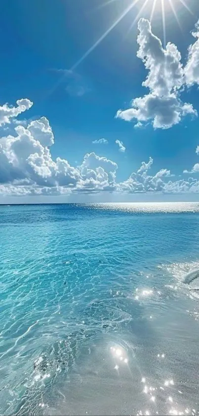 Beautiful sunny beach with clear blue ocean and fluffy clouds.