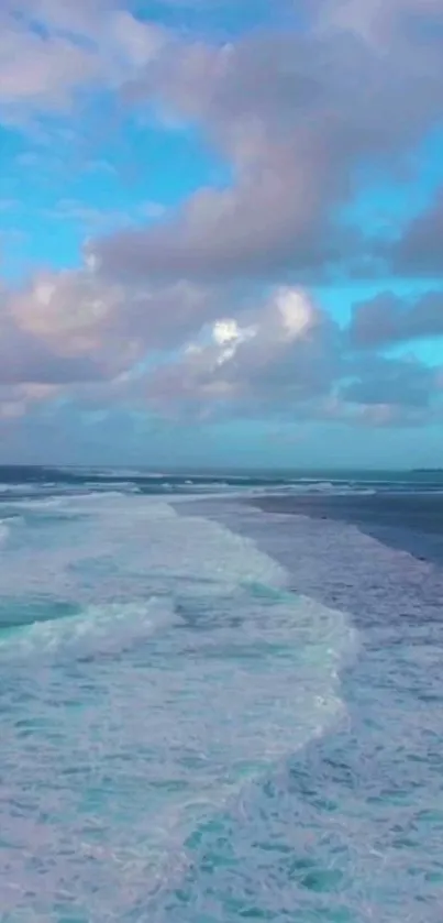 Serene ocean with waves and a blue sky.