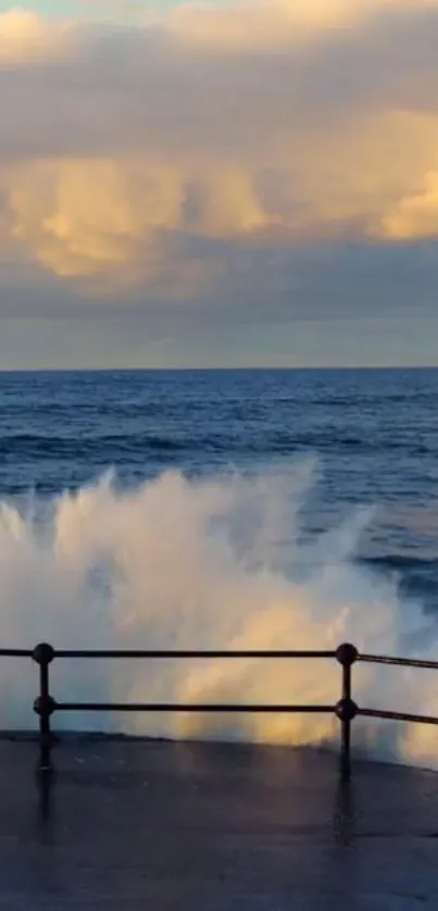 Dramatic ocean wave splashes against coastal barrier at sunset.