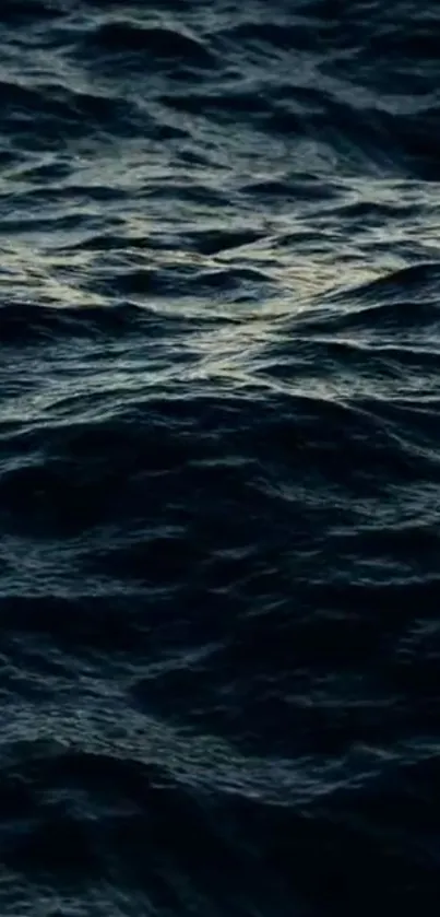 Serene dark blue ocean waves rippling gently.