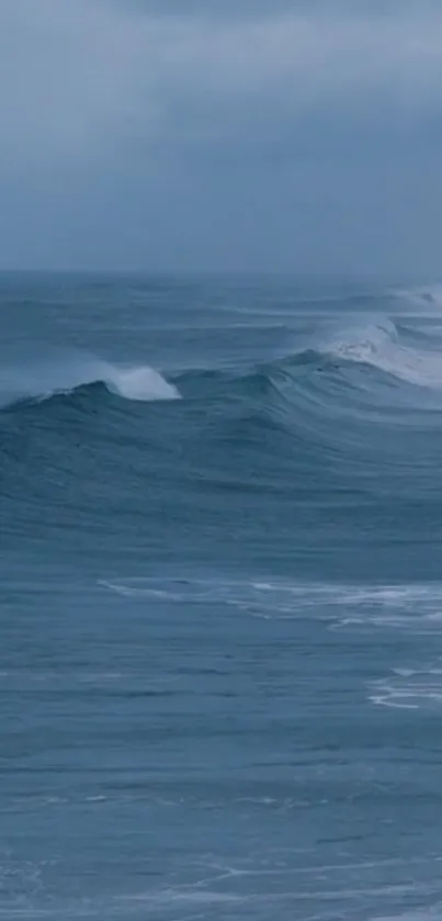 Serene ocean waves under a cloudy sky.