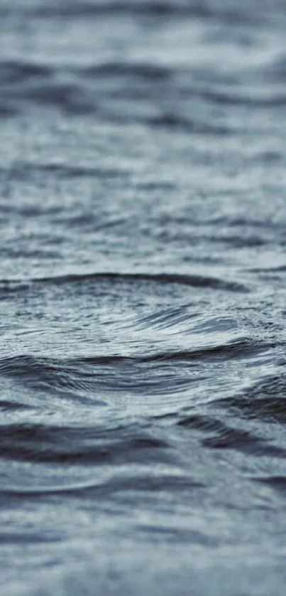 Serene ocean waves with blue tones as a peaceful mobile wallpaper.