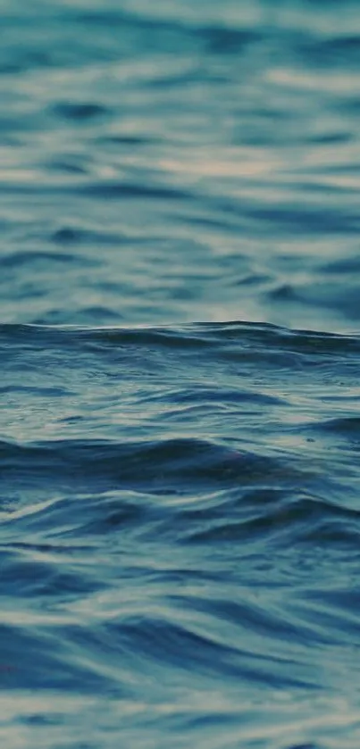 Serene ocean waves wallpaper featuring deep blue hues of the sea.