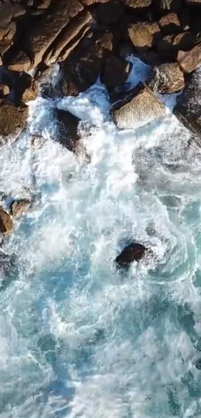 A mobile wallpaper featuring turquoise ocean waves crashing against rocks.