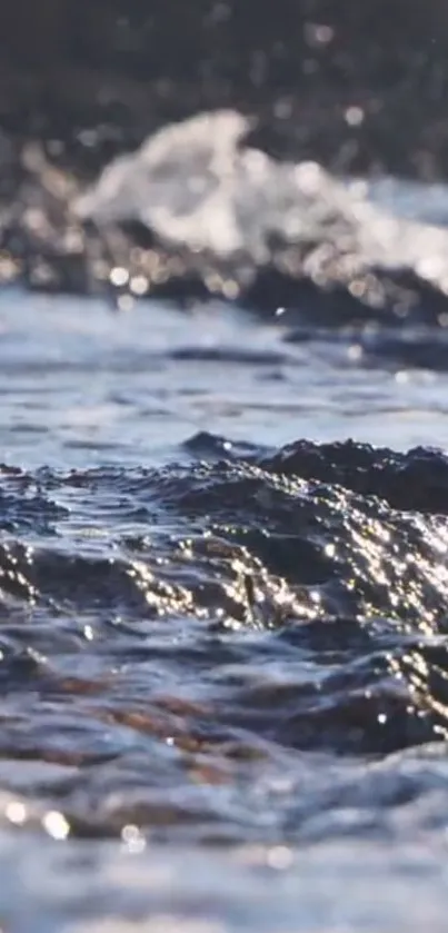 Serene dark blue ocean waves with sparkling sunlight.