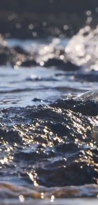 Close-up of serene ocean waves lapping rocky shores, with shimmering water details.