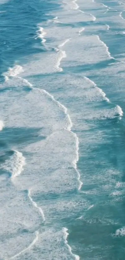 Aerial view of serene ocean waves with blue and white hues.