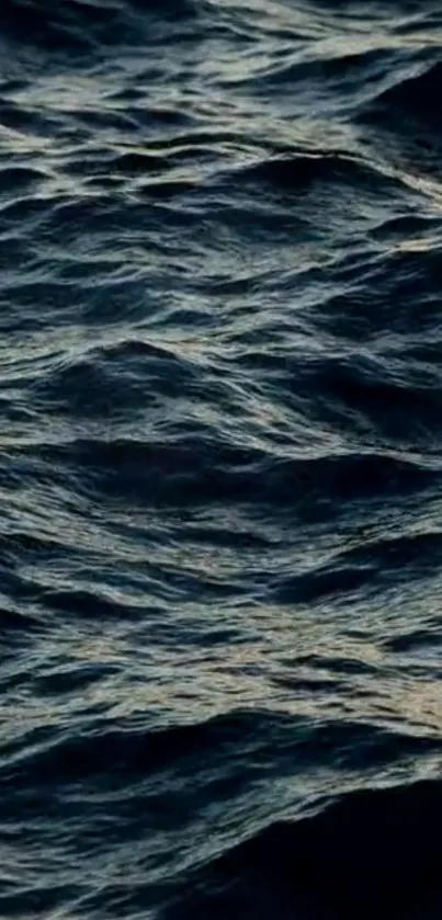 Serene dark blue ocean waves creating a calming texture on the screen.