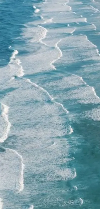 Serene blue ocean waves with white foam on a peaceful beach.