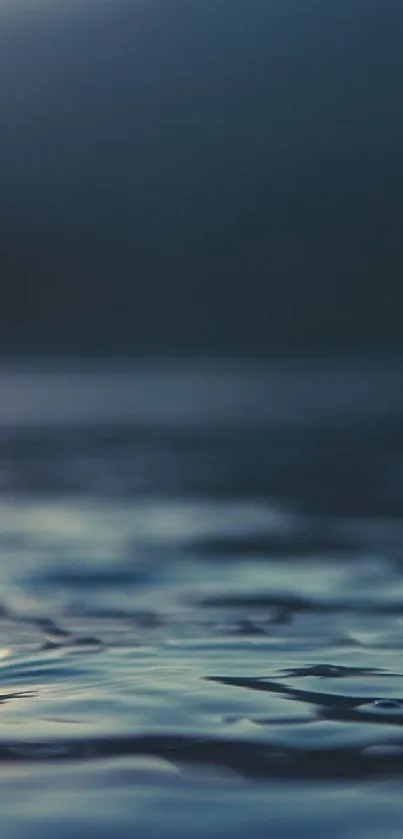 Serene ocean waves with blue hues and soft dawn light reflecting on water.