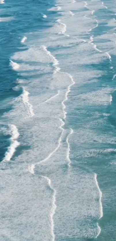 Tranquil ocean waves gently rolling to shore in blue hues.