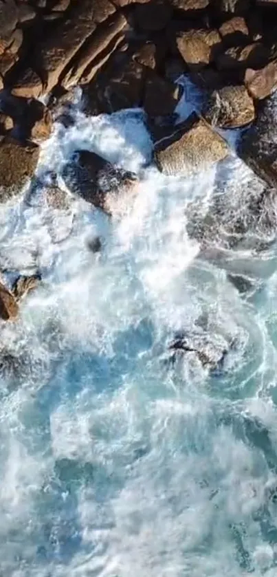 Aerial view of ocean waves crashing against rocky coastline.