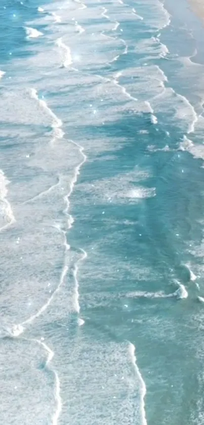 Serene ocean waves with blue tones on a sandy beach wallpaper.