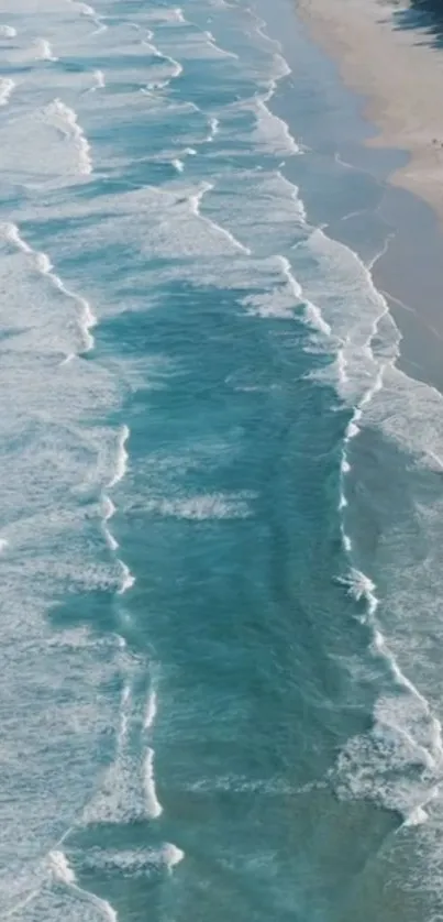 Serene ocean waves meeting the sandy shore in a tranquil beach setting.