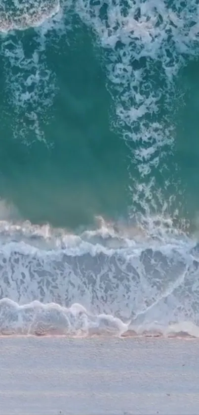 Serene turquoise ocean waves crashing on the sandy beach.