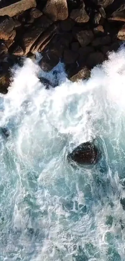 Aerial view of ocean waves crashing against rocks.