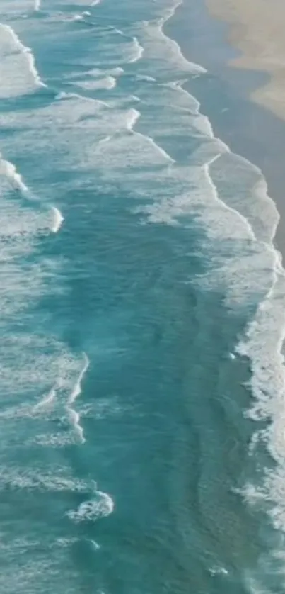 Beautiful azure ocean waves lapping a sandy beach.