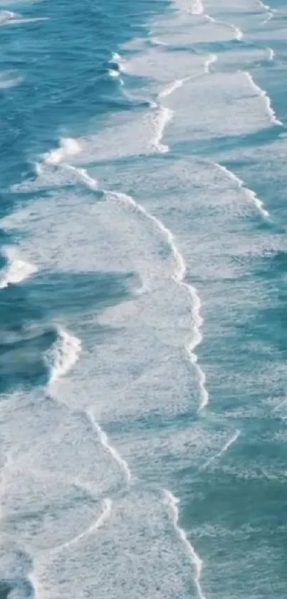 Aerial view of serene ocean waves creating a calming mobile wallpaper.