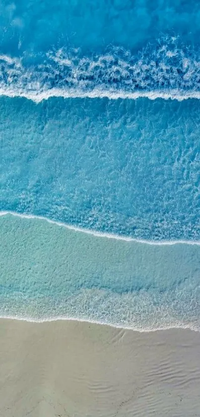 Aerial view of tranquil ocean waves in vibrant blue hues.