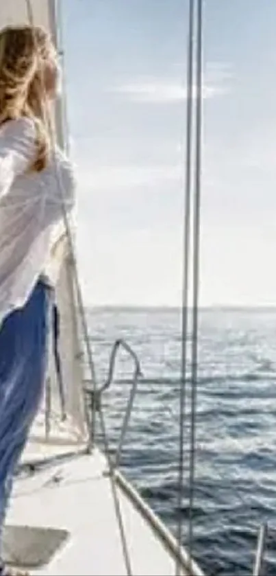 Woman standing on yacht, gazing at the tranquil ocean under a clear sky.