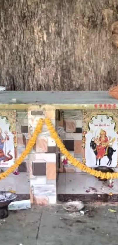 Serene outdoor altar with vibrant garlands and idols under a tree.