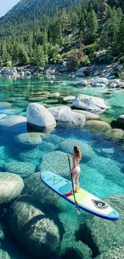 Woman paddleboarding on turquoise waters surrounded by nature.