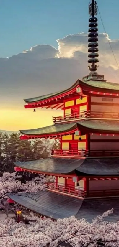 Japanese pagoda with cherry blossoms at sunset.