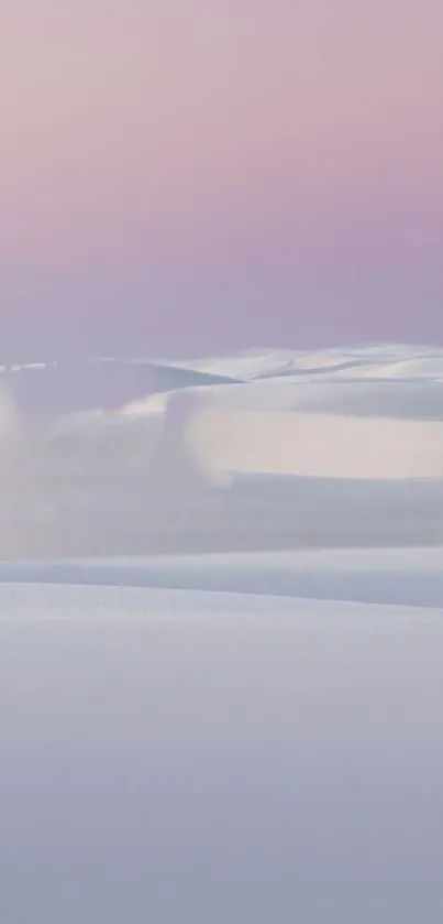 Serene landscape with pastel skies over snow dunes.