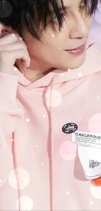 Stylish pink hoodie with serene design.