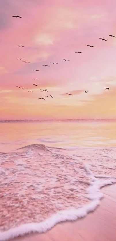 Pink ocean sunset with waves and flying birds in a serene setting.