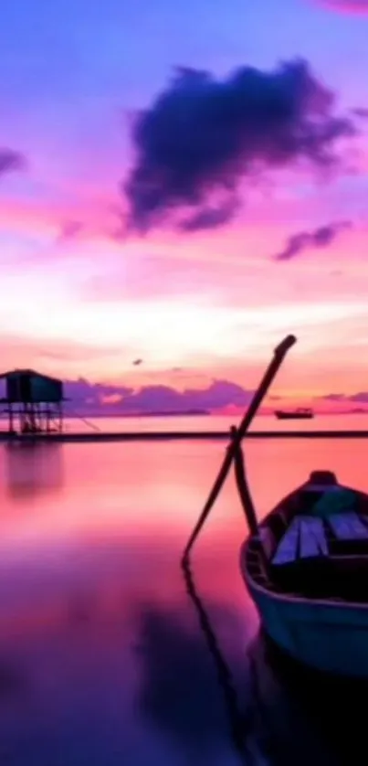 Boat at sunset with pink sky reflecting on calm waters.