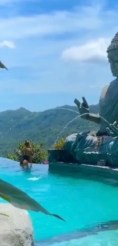 Buddha statue by mountain pool with sky background.