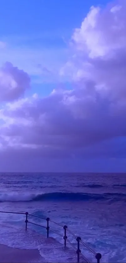 Purple sea view with gentle waves and clouds at horizon.