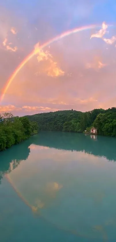 A rainbow arches over a serene river with lush greenery at sunset.