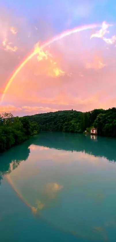 Rainbow arcs over tranquil lake under a vibrant sky.