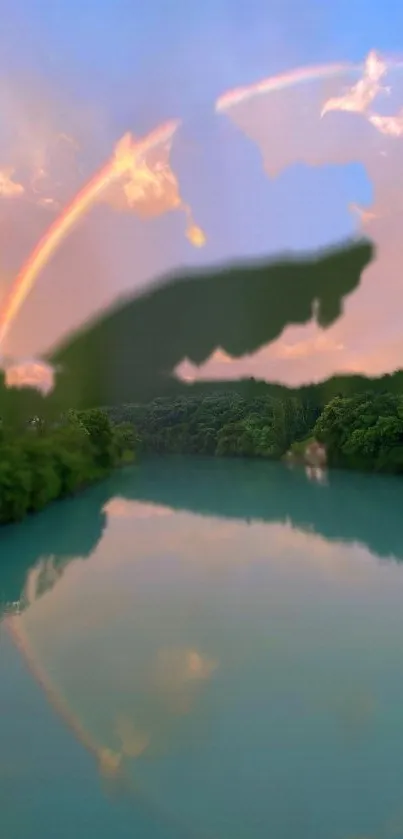 Vibrant rainbow over a tranquil river and lush greenery.