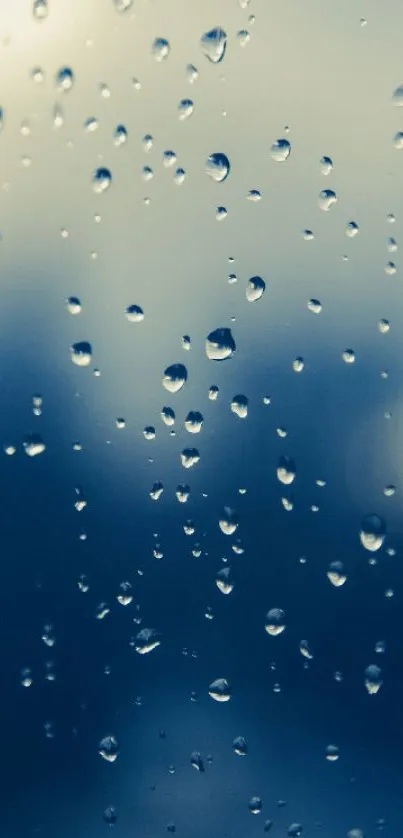 Raindrops on a window with blue gradient background.