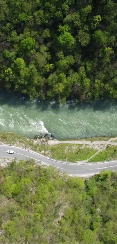 Aerial view of a road by a lush, green riverbend.