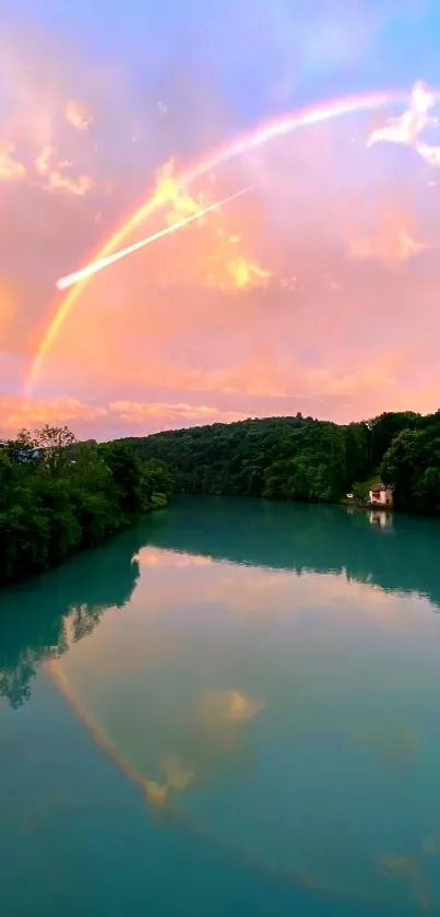 Peaceful river view with rainbow across the sky.