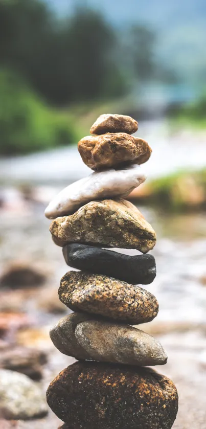 Balanced stone stack by river, serene and calming.