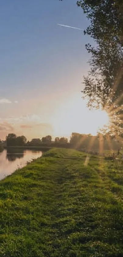 Serene sunset over a reflective river with lush greenery.