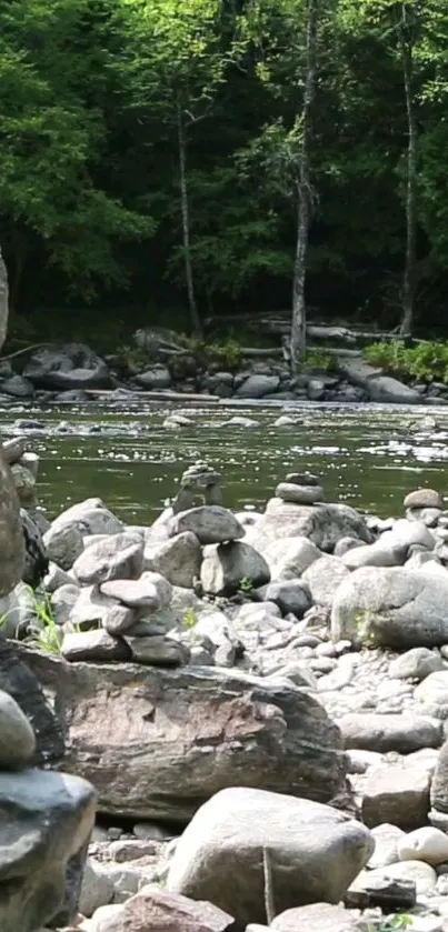 Serene river view with stone stack and green forest background.