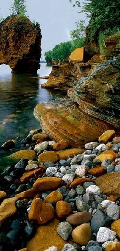 Serene rocky lakeside scene with lush greenery and clear waters.